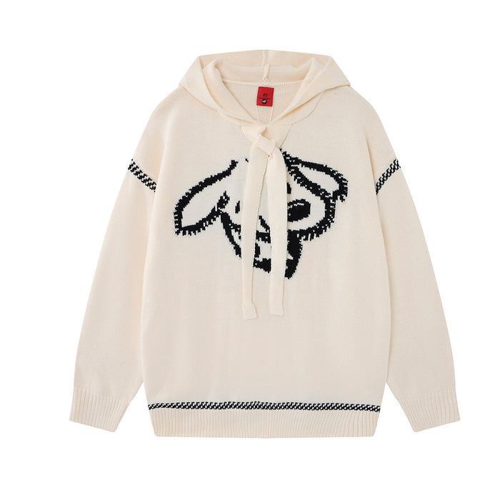 Oversized jacquard knit hoodie sweater in cream with bold black graphic motif and houndstooth stripe trim