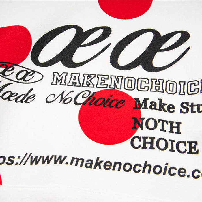 Close-up of black chest lettering over the white hoodie fabric and red polka dot print