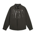 Black long-sleeve button-up shirt with white vertical paint-stroke graphics and small red chest lettering