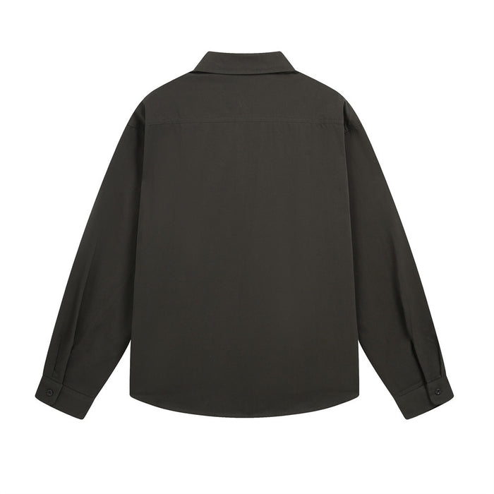 Back view of a plain black long-sleeve button-up shirt with a pointed collar and buttoned cuffs