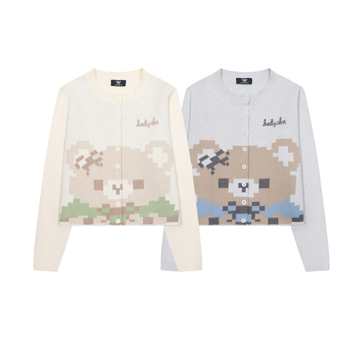 Front view of cream and light gray knit cardigans with pixel bear graphics, round necks, and button fronts