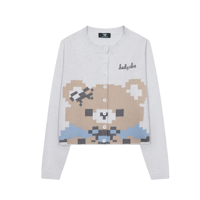 Front view of the light gray knit cardigan with a pixel bear graphic, round neck, and white button closure