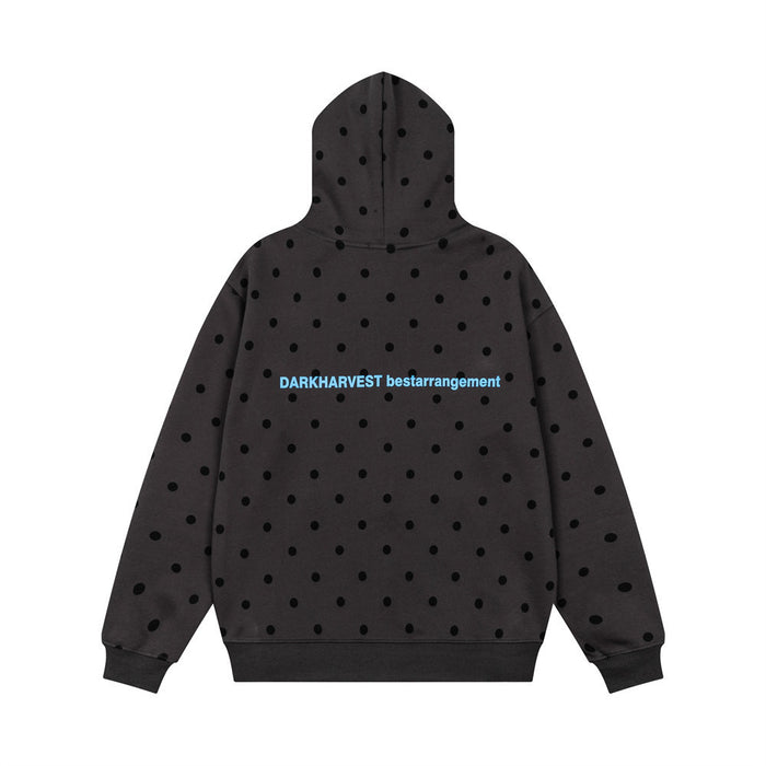 Black polka dot zip-up hoodie shown from the back with blue and pink text across the upper back
