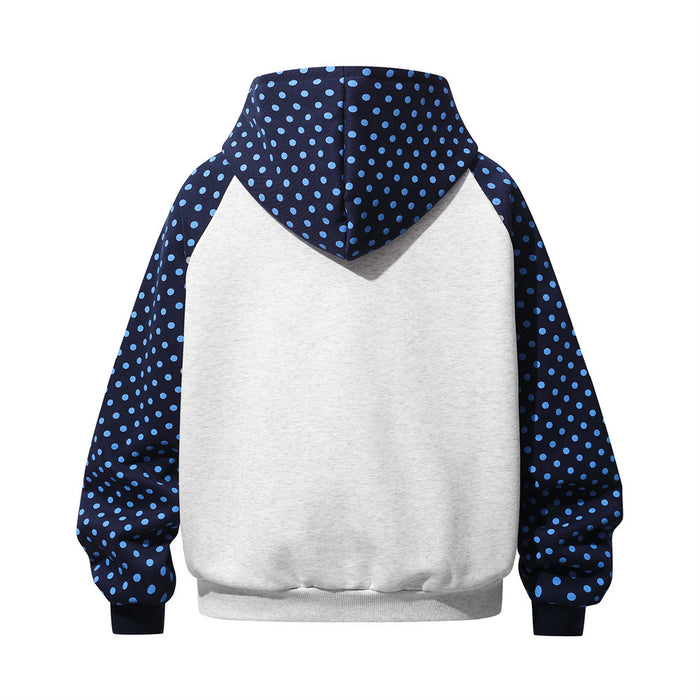 Back view of a light gray hoodie with navy blue polka dot raglan sleeves and hood