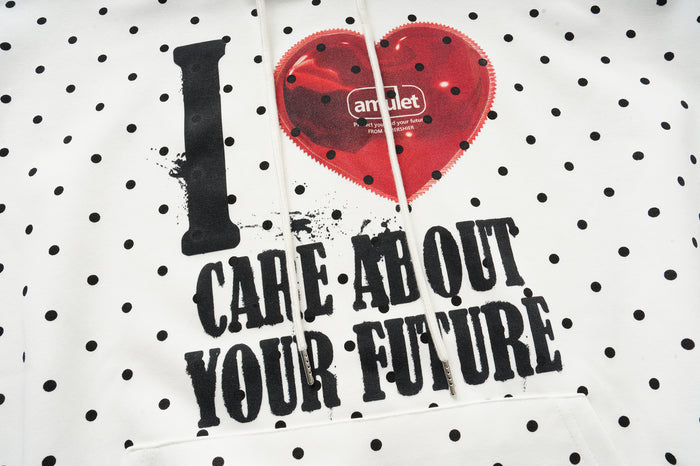 Close-up of the hoodie front showing a red heart, black I graphic, and the text Care About Your Future