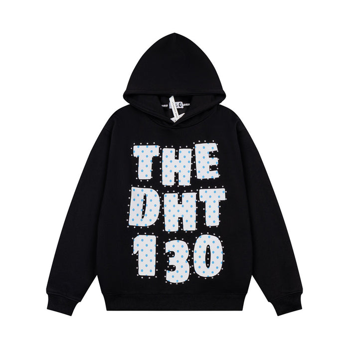 Front view of a black oversized hoodie with white polka dot lettering and rhinestone accents
