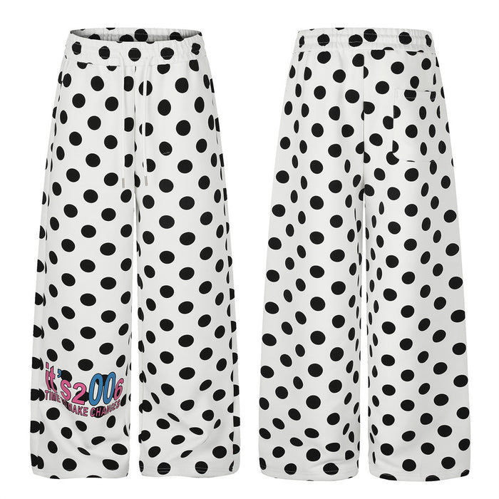 White wide-leg pants with black polka dots shown in front and back views, including a colorful lower-leg graphic