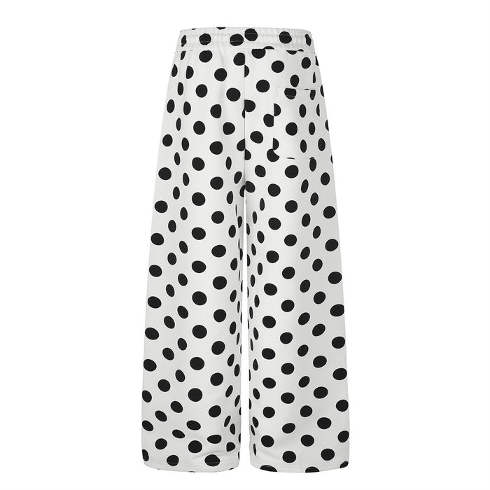 Front view of white straight-fit wide-leg pants with an all-over black polka dot pattern