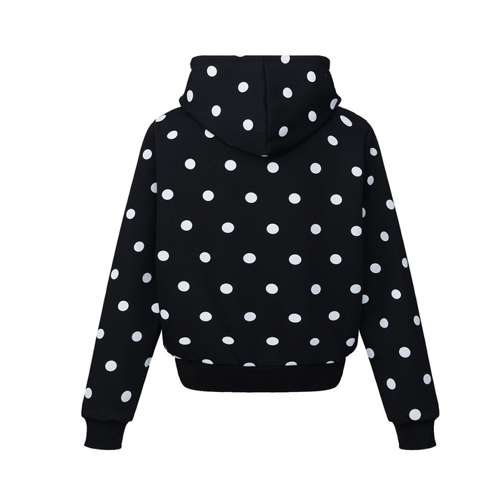 Back view of the black polka dot hoodie with an oversized hood and ribbed waistband