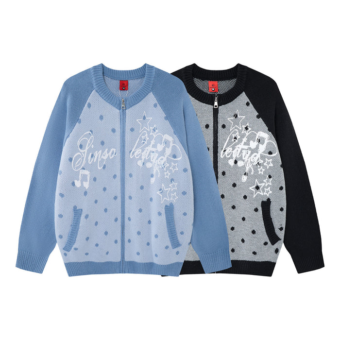 Blue and black knit zip-up cardigans with polka dots, star and music note graphics shown from the front