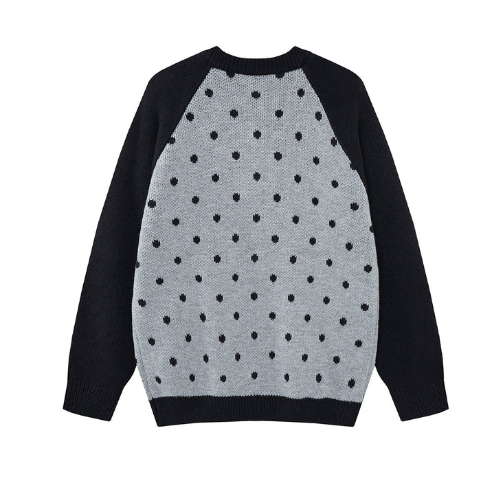 Back view of a black and gray knit cardigan with black polka dots and contrasting black sleeves