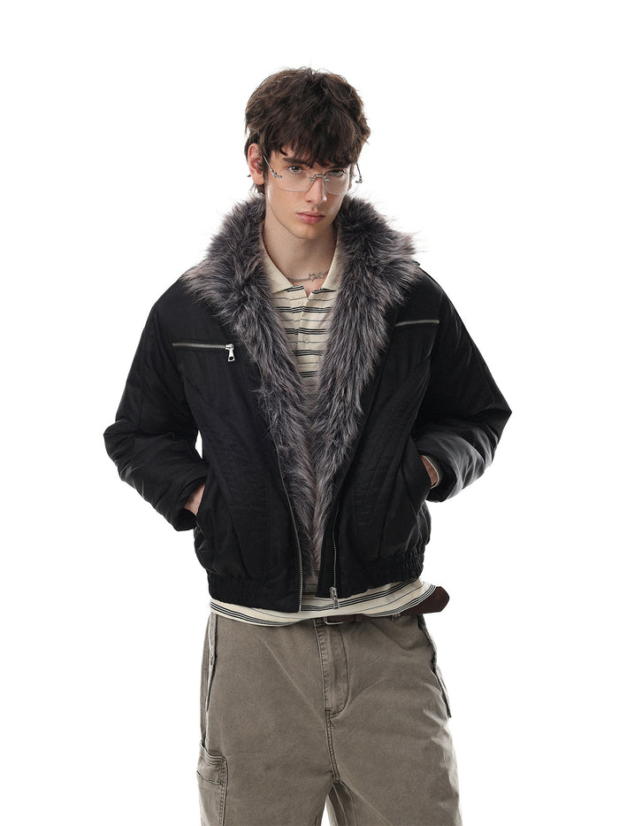Model wearing a black padded jacket with a gray faux fur collar, zippered chest pockets, and front pockets