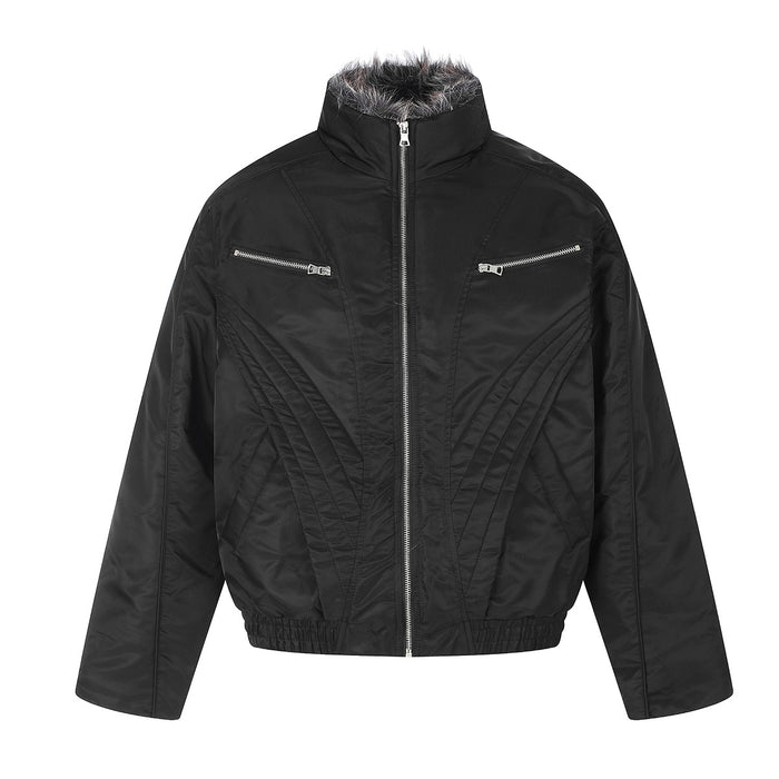 Black padded jacket front with faux fur collar, central silver zipper, zippered chest pockets, and stitched panels