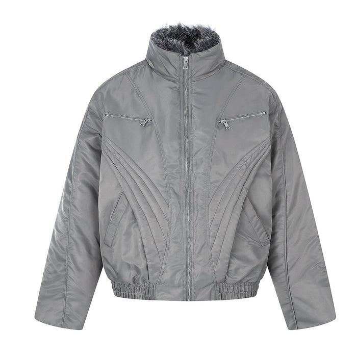 Gray padded jacket front with faux fur collar, silver zippers, zippered chest pockets, and curved stitched detailing