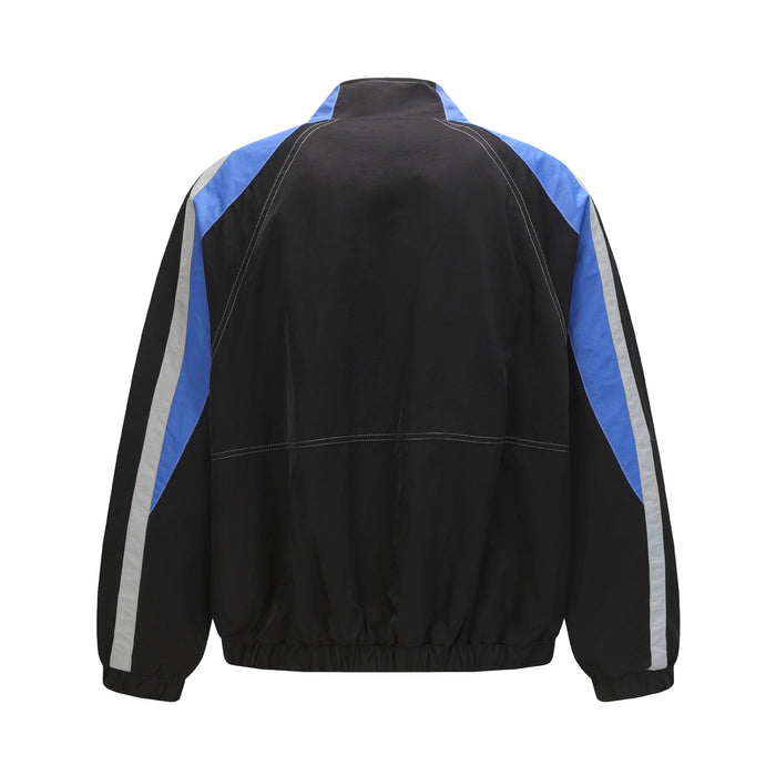 Back view of the black and blue colorblock varsity bomber jacket with striped sleeves