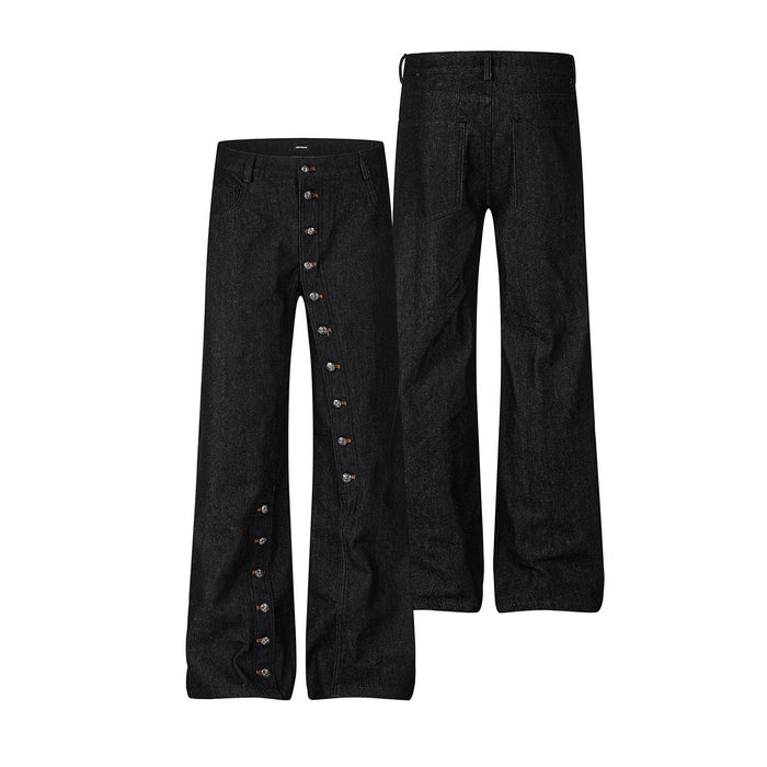 Raw black denim jeans shown front and back, with a row of side snap buttons along both outer legs