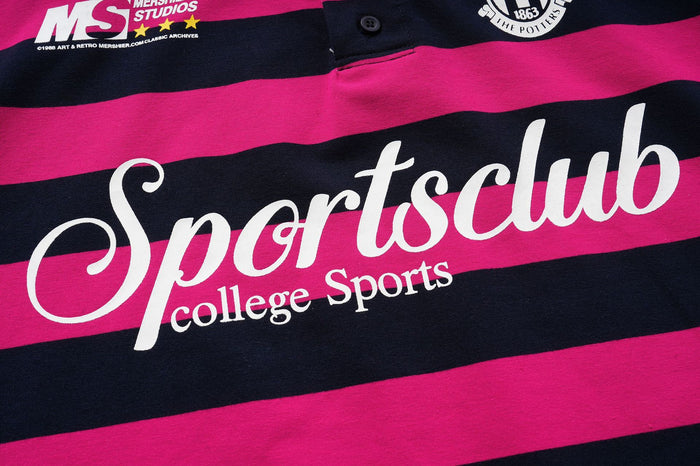 Close-up of white Sportsclub College Sports lettering across the front of the hot pink and navy striped polo