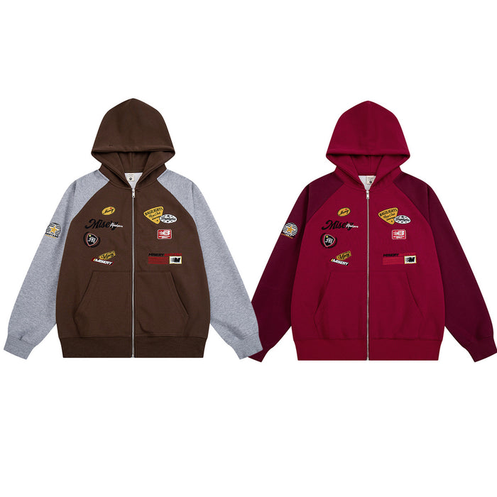 Front view of brown and burgundy colorblock zip-up hoodies with gray raglan sleeves and racing patches