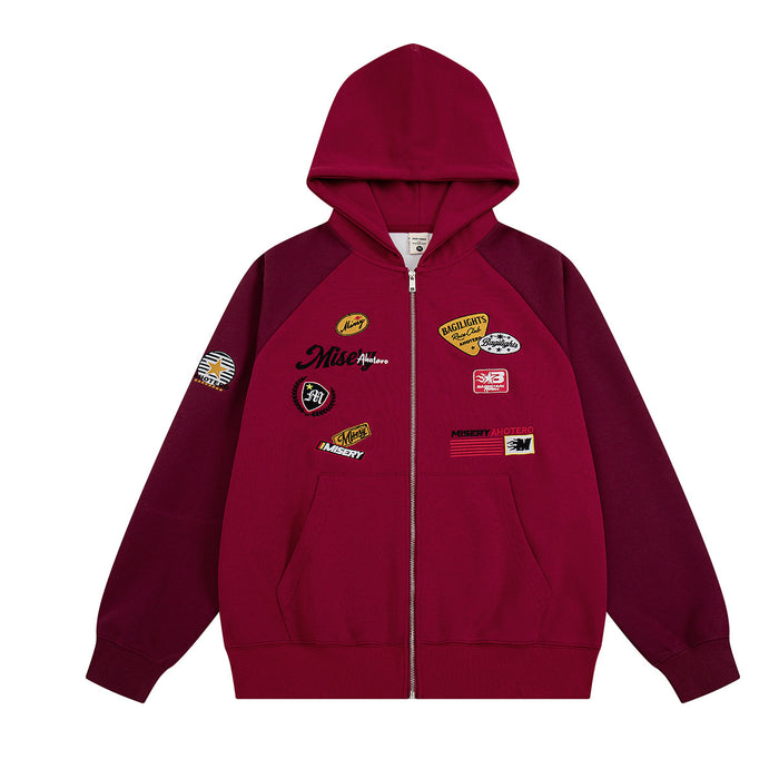 Front view of burgundy zip-up hoodie with hood, kangaroo pockets, and multiple racing patches