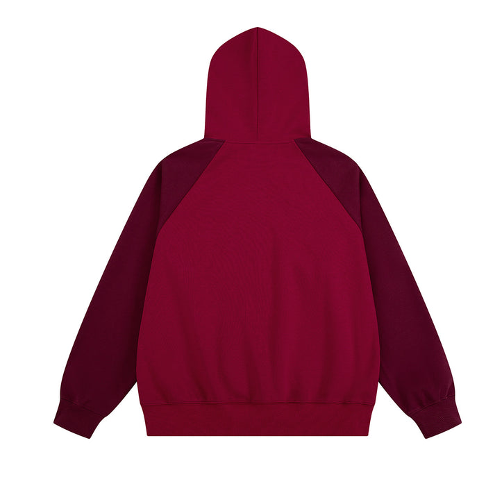 Back view of burgundy zip-up hoodie showing the hood, raglan seams, and plain back