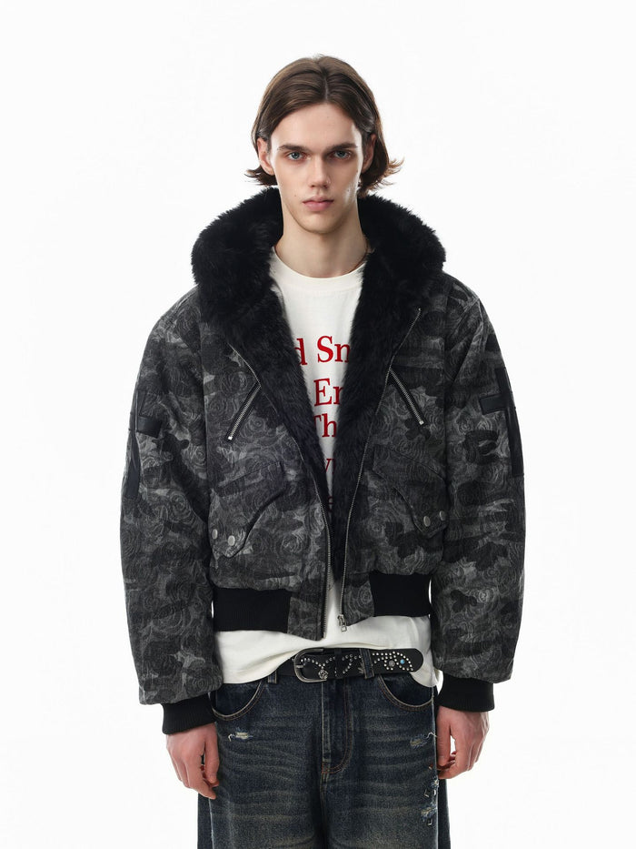 Oversized hooded bomber jacket in dark rose camouflage jacquard with black faux fur collar and cross back patch