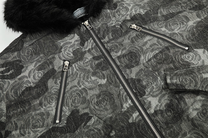 Close-up of the camouflage jacket front showing the center zipper and angled zip pockets
