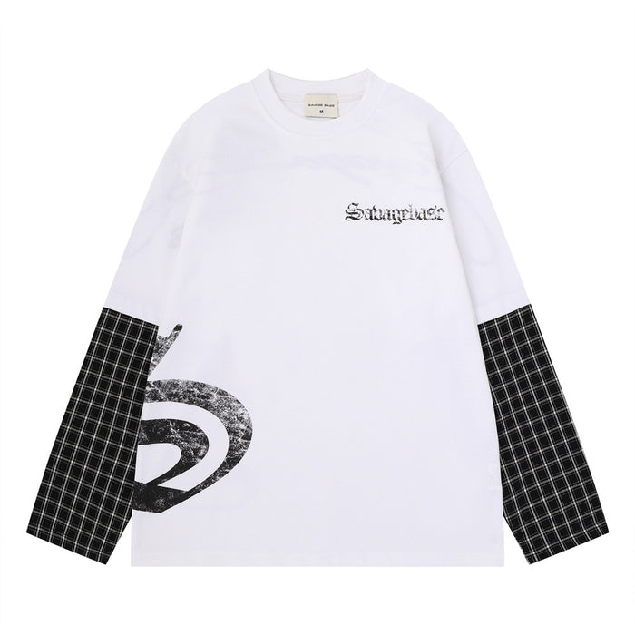 White oversized long sleeve tee front with black chest lettering, black plaid sleeve panels, and a distressed side graphic