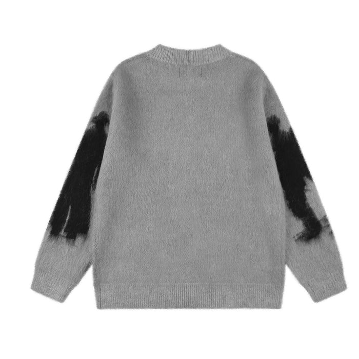 Back view of the gray knit zip-up cardigan, showing a plain body and black sleeve graphics