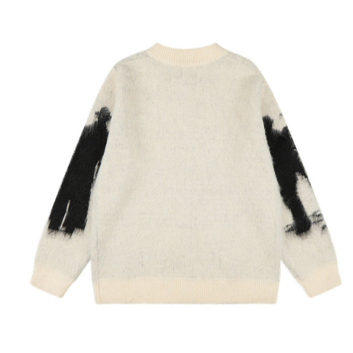 Back view of the cream knit zip-up cardigan with a plain body and black graphics on the sleeves