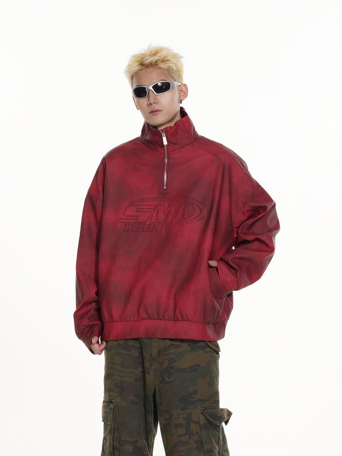 Red acid-wash half-zip pullover modeled from a slight side angle with one hand in a pocket