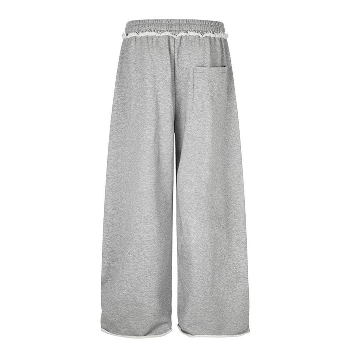 Back view of gray wide-leg sweatpants showing the elastic waistband and single rear pocket