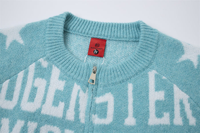 Close-up of the turquoise cardigan ribbed collar, red neck label, and silver zipper pull