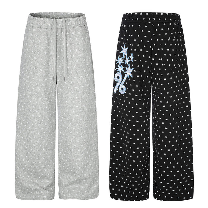 Gray and black wide-leg sweatpants with repeating white star prints, shown side by side