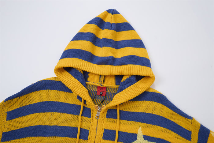 Close-up of the mustard yellow and blue striped knit hoodie showing the hood, drawstrings, and upper zipper