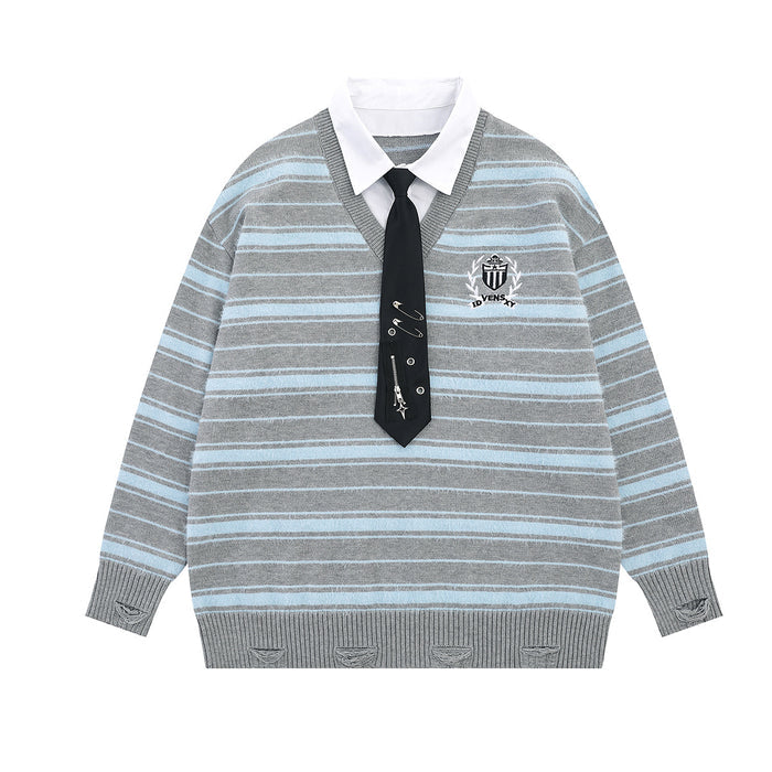 Oversized striped knit sweater with layered white shirt collar, black necktie detail, and embroidered crest badge in heather