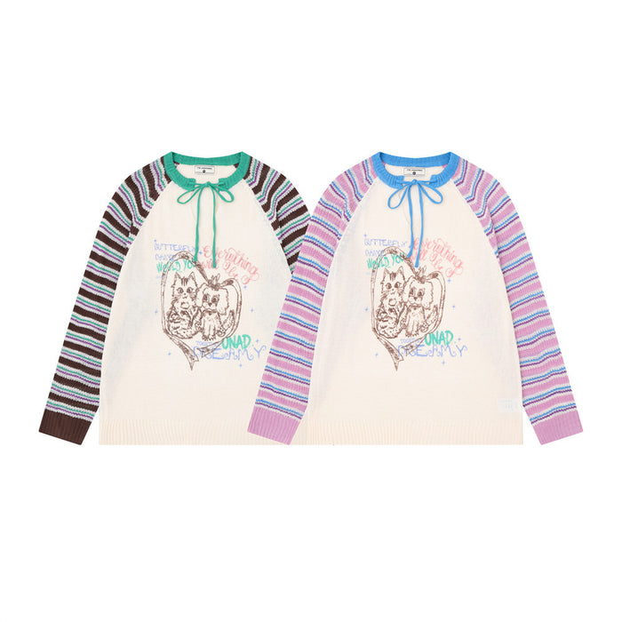 Two colorblock knit pullovers shown from the front, with striped raglan sleeves, tie necks, and cat graphics