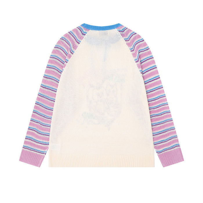 Back view of the cream pullover with pink and blue striped raglan sleeves and a ribbed hem