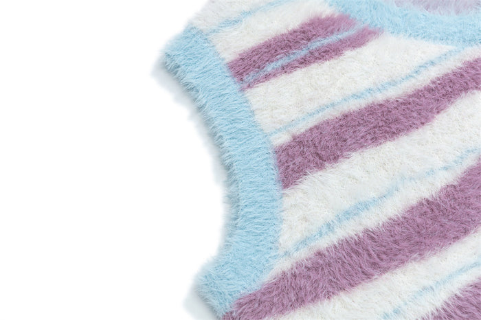 Close-up of the light blue ribbed armhole trim on a fuzzy striped sweater vest