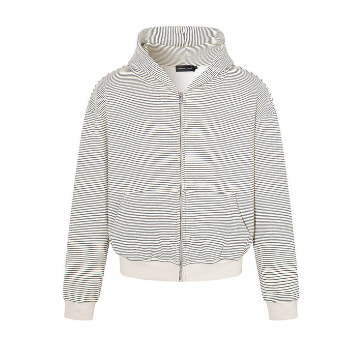 Oversized boxy striped zip-up hoodie in cream white with fine horizontal stripes, ribbed cuffs, and full-length front zip