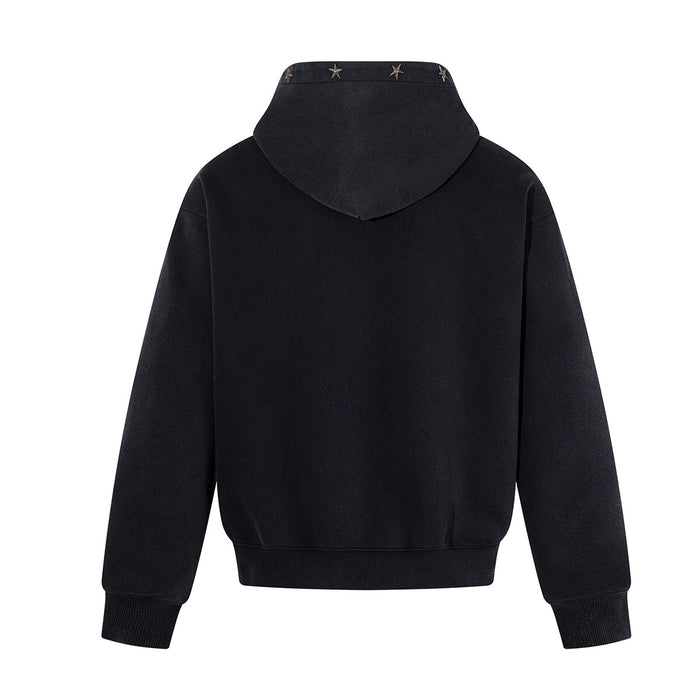Back view of a black zip-up hoodie with a plain body, hood, ribbed hem, and star rivets