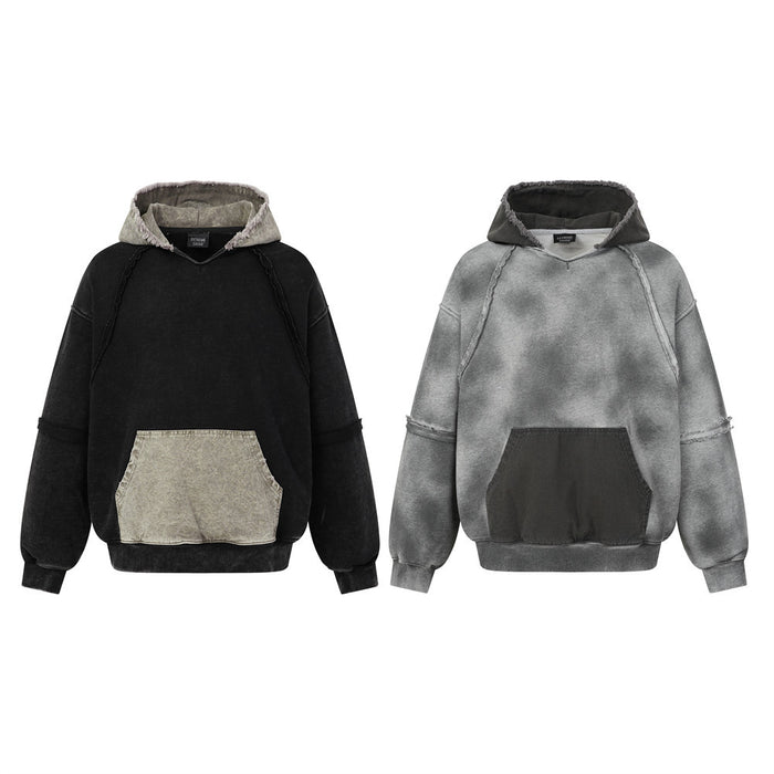 Two acid-washed pullover hoodies shown from the front in black and gray with contrasting kangaroo pockets