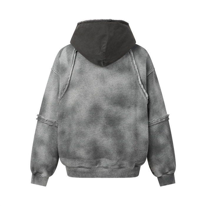 Gray acid-washed hoodie shown from the back with a dark hood and exposed seam details