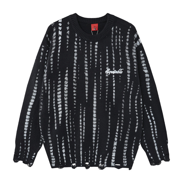 Black oversized crew neck knit sweater with vertical distressed white stripes, ribbed trim, and chest script logo