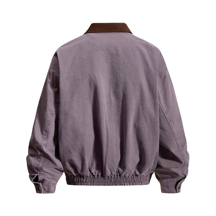 Back view of a purple-gray washed canvas bomber jacket with brown corduroy collar, gathered hem, and cuff tabs