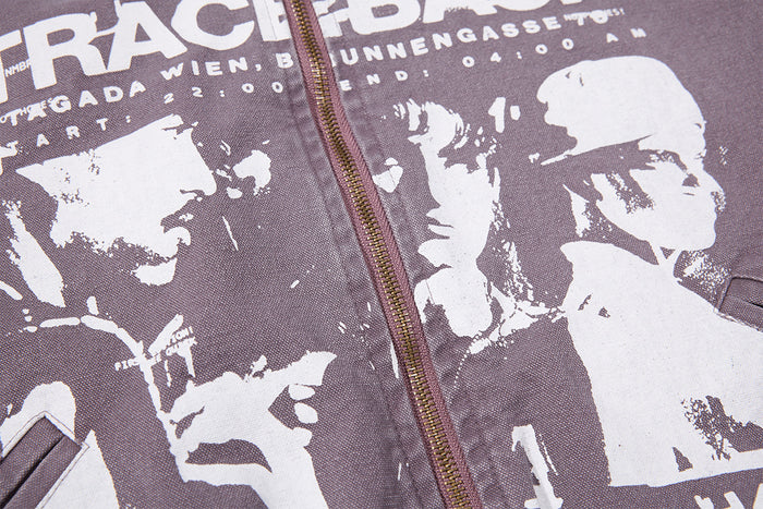 Detailed view of the jacket’s white printed portraits and lettering across the purple-gray canvas front