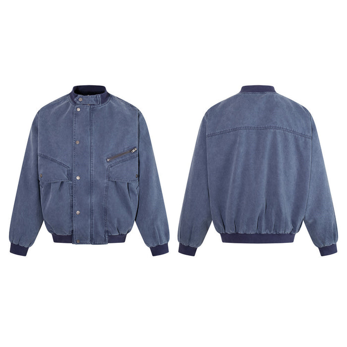 Washed blue canvas bomber jacket shown in front and back views with stand collar, large pockets, ribbed cuffs and hem