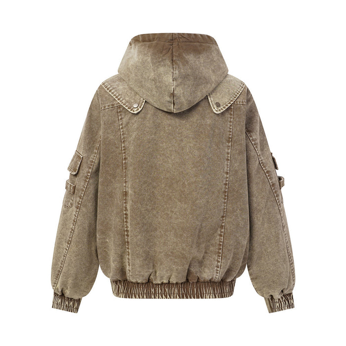 Washed tan hooded bomber jacket shown from the back with seamed canvas panels and elastic cuffs
