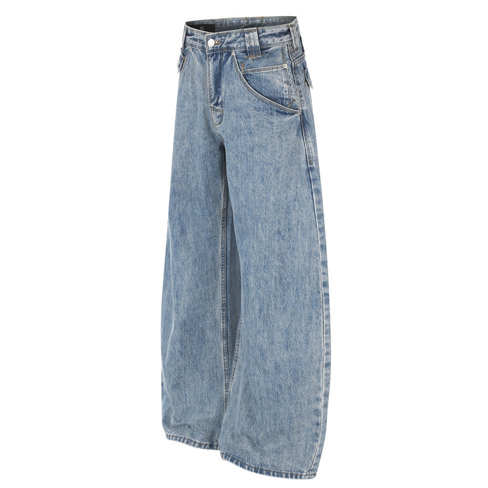 Light blue washed denim jeans shown at a three-quarter front angle with curved pockets and wide barrel legs