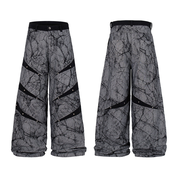 Gray wide-leg jeans with black crackle print, diagonal studded stripes, and front and back views