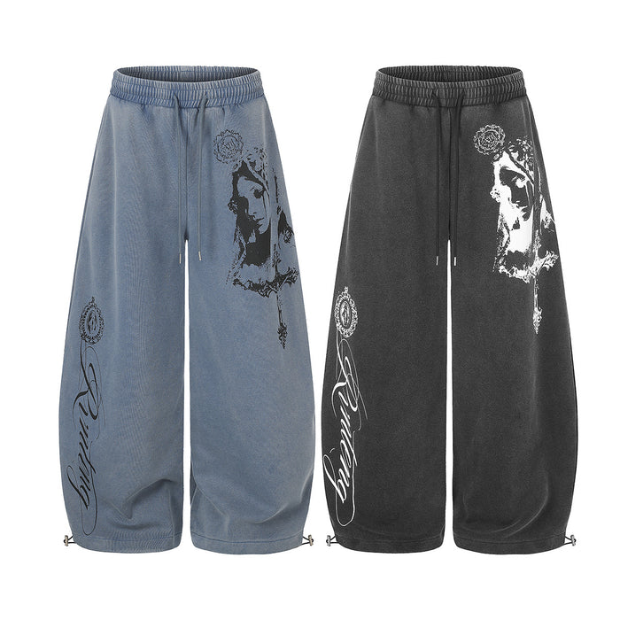 Wide-leg sweatpants in washed blue and black with gothic portrait and script prints